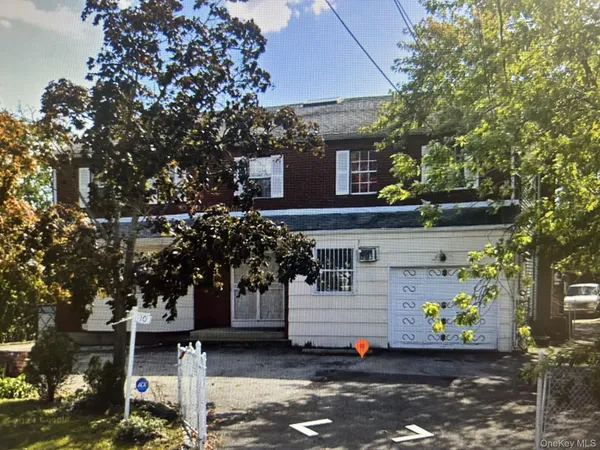 a front view of a house with a garage