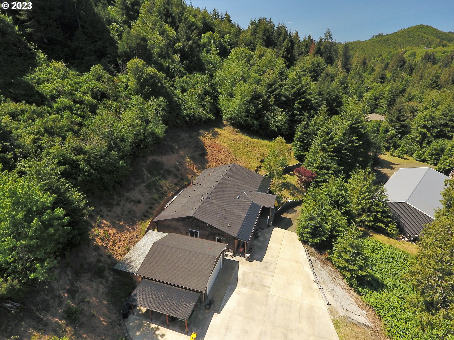 56339 Baker Road Coquille, OR 97423 - Photo 4 of 40 an aerial view of a house with a yard