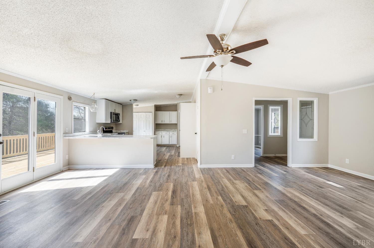 111 Bandy Road Gladys, VA 24554 - Photo 14 of 54 a view of empty room with wooden floor and fan