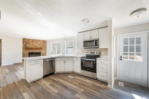 a kitchen with a sink and a window