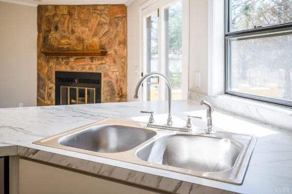 a kitchen with a stove and cabinets