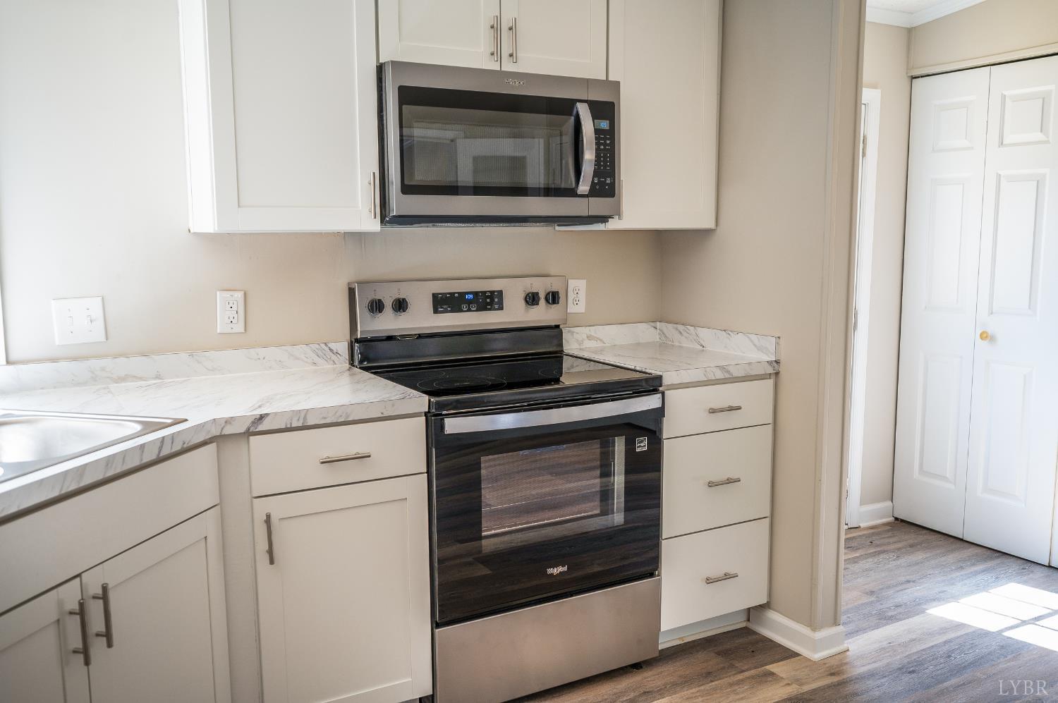 111 Bandy Road Gladys, VA 24554 - Photo 19 of 54 a kitchen with a stove and cabinets