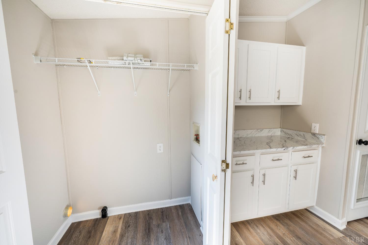 111 Bandy Road Gladys, VA 24554 - Photo 22 of 54 a view of walk in closet with wooden floor