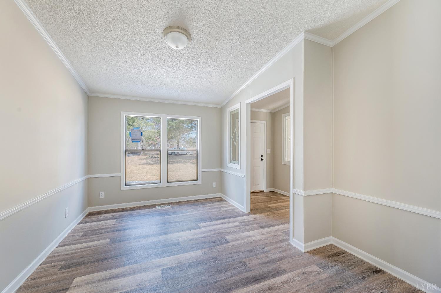 111 Bandy Road Gladys, VA 24554 - Photo 23 of 54 an empty room with wooden floor and windows