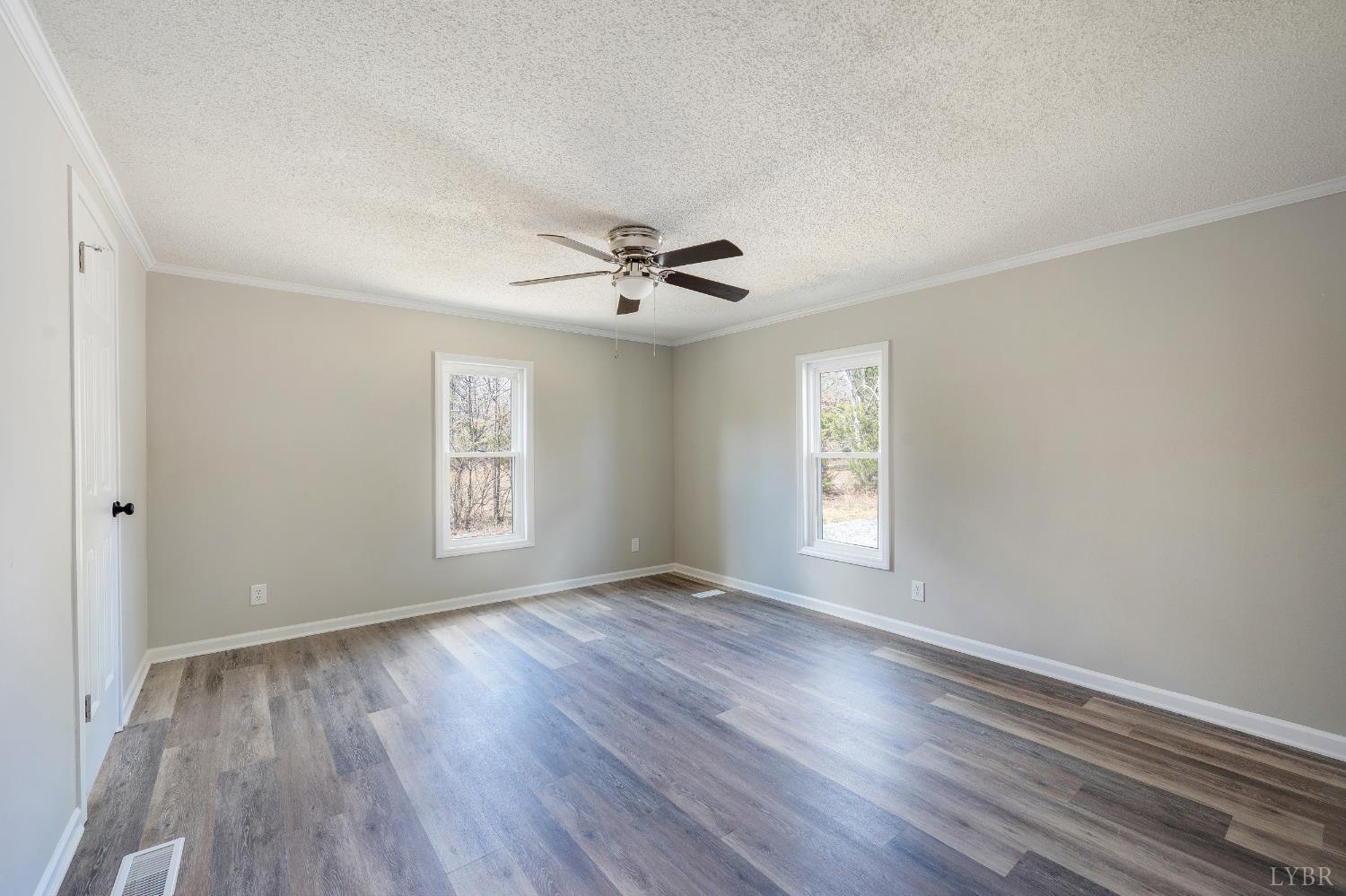 111 Bandy Road Gladys, VA 24554 - Photo 25 of 54 a view of an empty room with a window and wooden floor