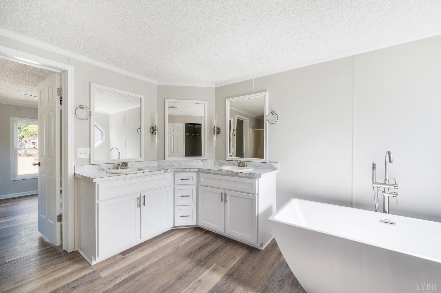 111 Bandy Road Gladys, VA 24554 - Photo 27 of 54 a spacious bathroom with a granite countertop sink mirror and bathtub