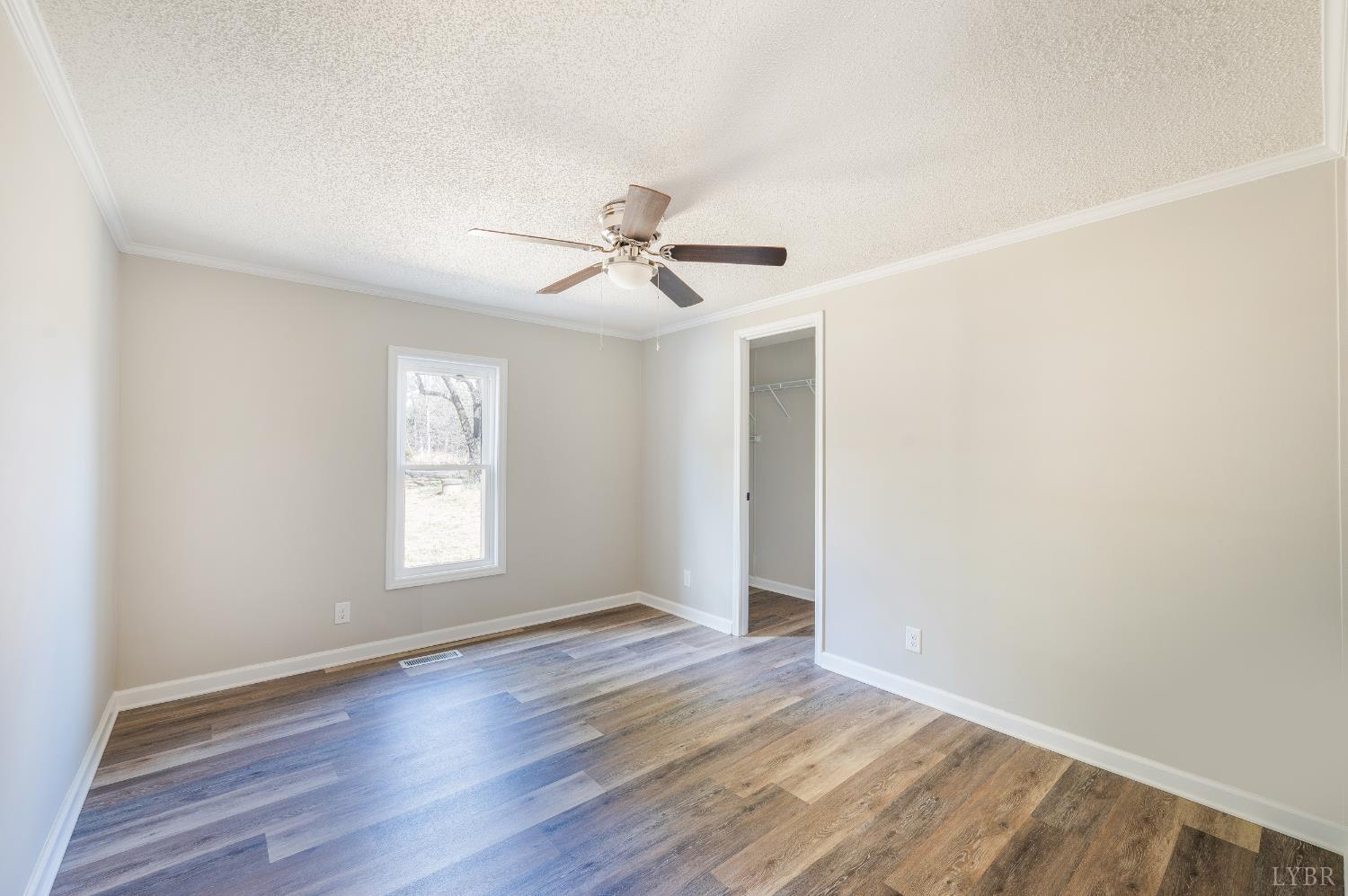 111 Bandy Road Gladys, VA 24554 - Photo 36 of 54 an empty room with wooden floor and windows