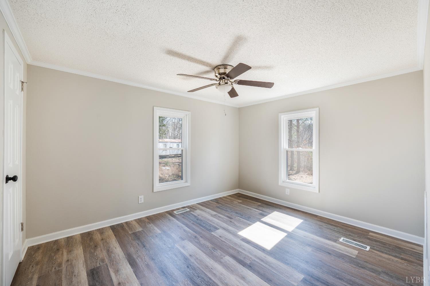111 Bandy Road Gladys, VA 24554 - Photo 37 of 54 an empty room with wooden floor and windows
