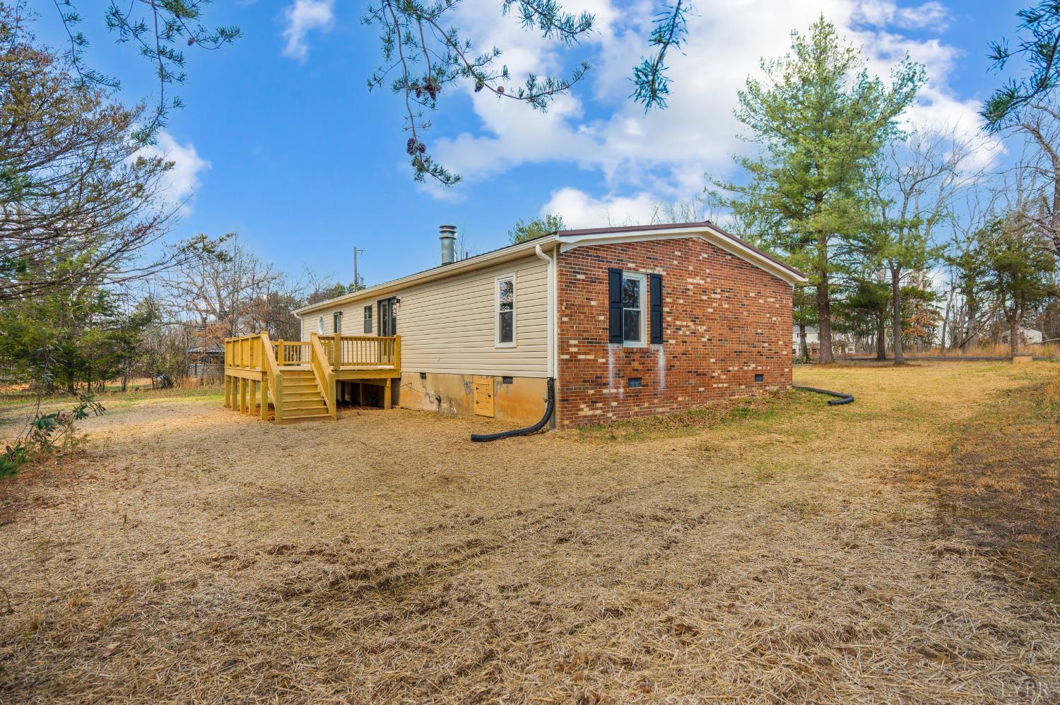 111 Bandy Road Gladys, VA 24554 - Photo 45 of 54 a view of a yard in front of a house with large trees