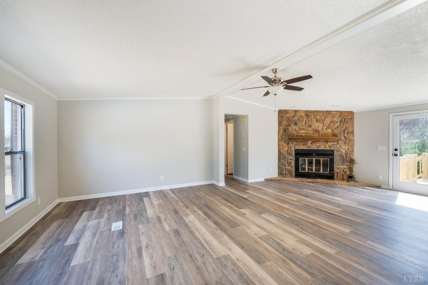 111 Bandy Road Gladys, VA 24554 - Photo 9 of 54 wooden floor in an empty room with a fireplace