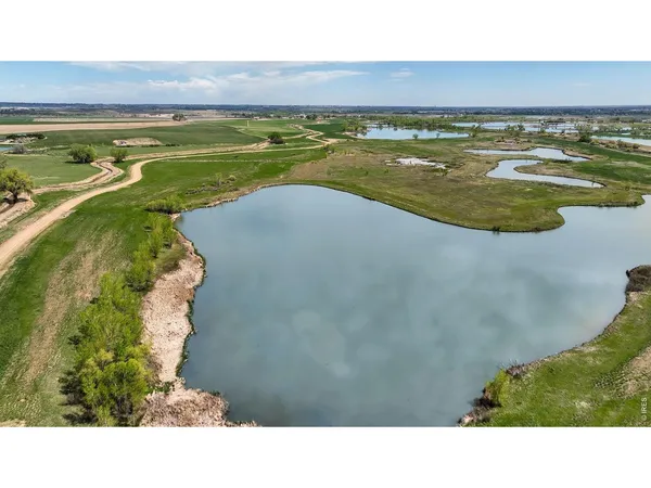 a view of a field with an ocean