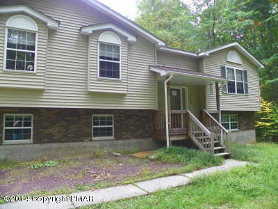 543 Rinker Road Stroudsburg, PA 18360 - Photo 4 of 8 a front view of a house with a yard