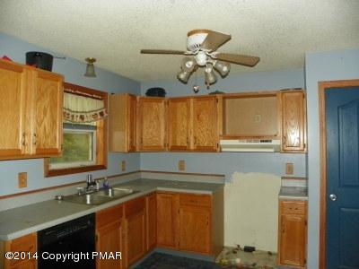 543 Rinker Road Stroudsburg, PA 18360 - Photo 6 of 8 a kitchen with a sink and cabinets