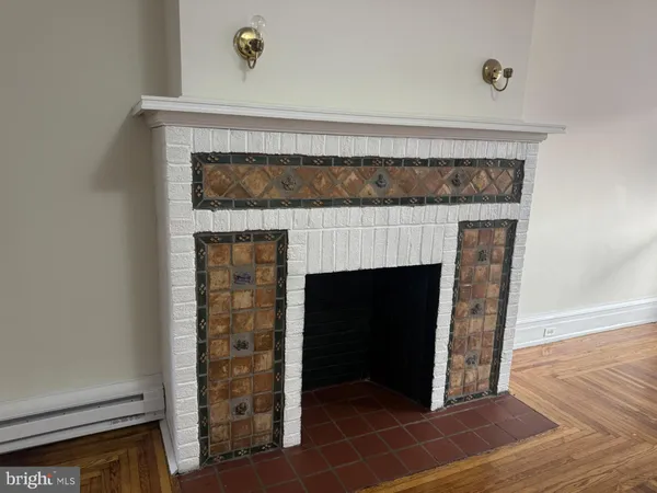 a room with fireplace and wooden floor