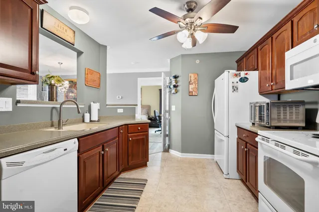 a kitchen with stainless steel appliances sink and cabinets