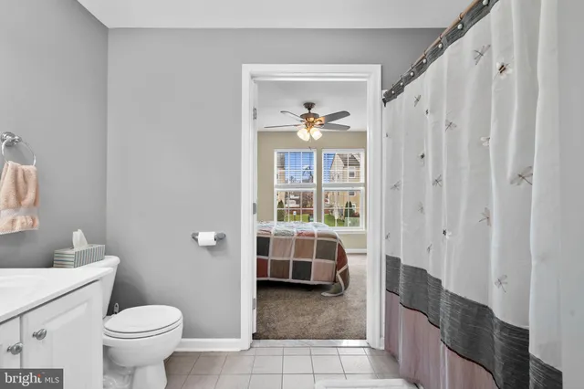 a bathroom with a toilet a sink and bath tub