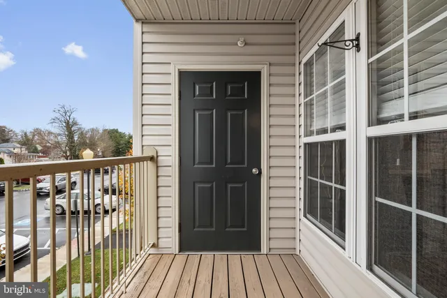a view of a balcony with wooden floor