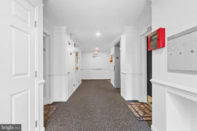 a view of a hallway with closet