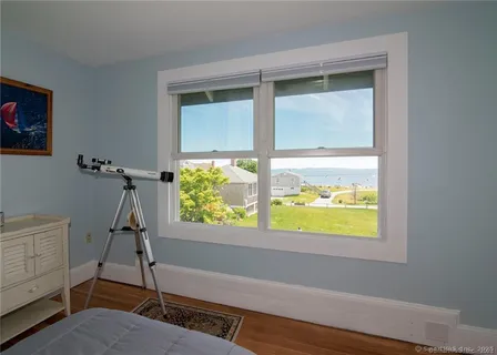 a view of an empty room and a window