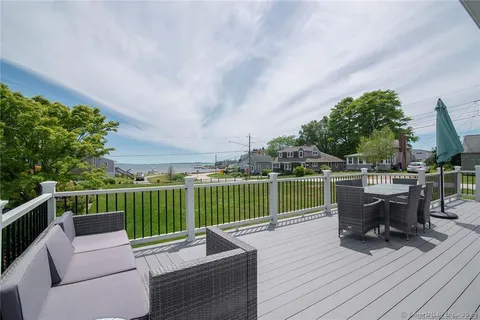 a view of sitting area with furniture in wooden deck