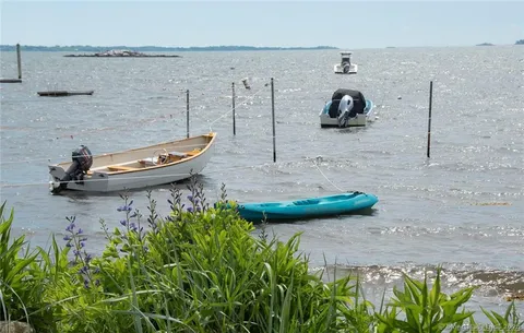 a view of a lake with a house in the background