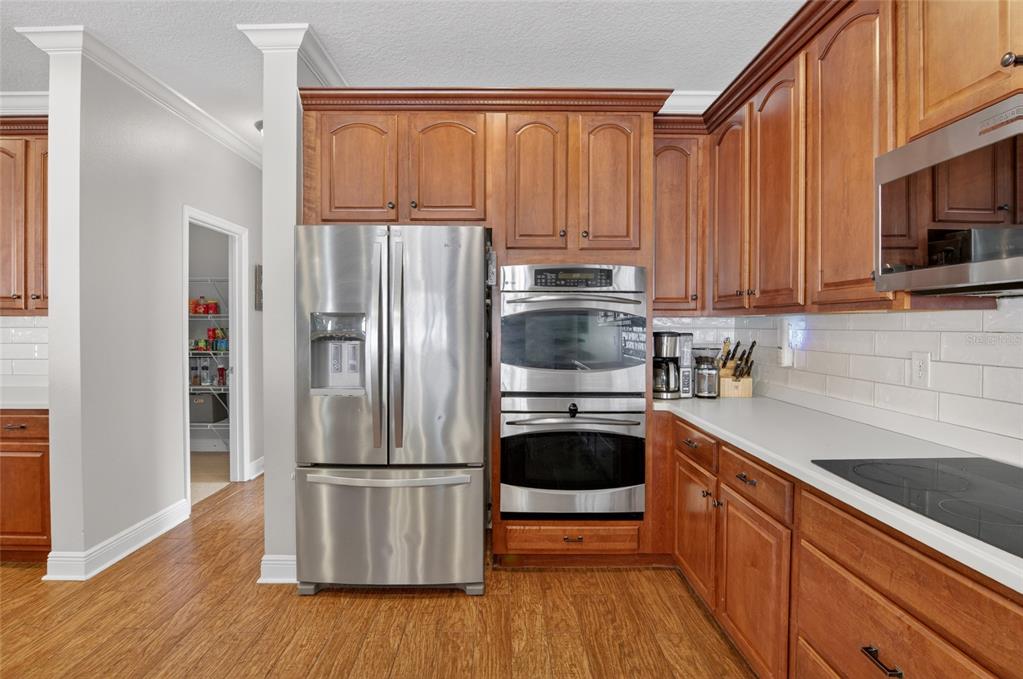 650 Setting Sun Drive Winter Garden, FL 34787 - Photo 12 of 60 a kitchen with a refrigerator sink and microwave