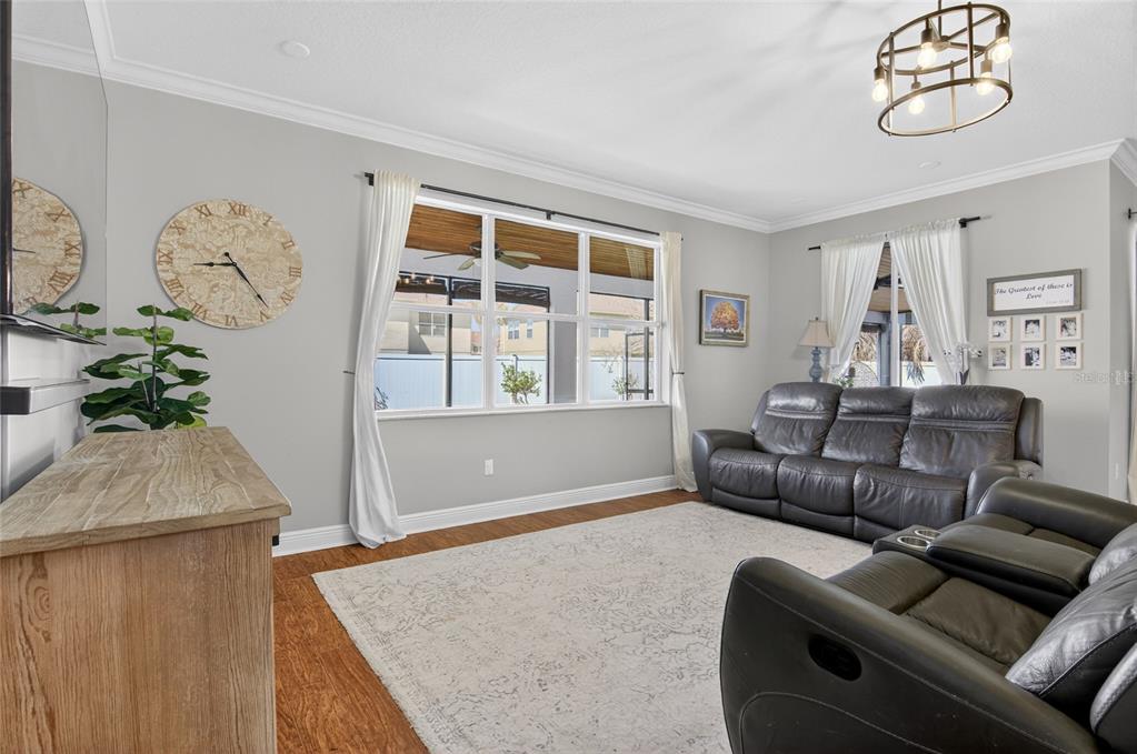 650 Setting Sun Drive Winter Garden, FL 34787 - Photo 17 of 60 a living room with furniture and wooden floor