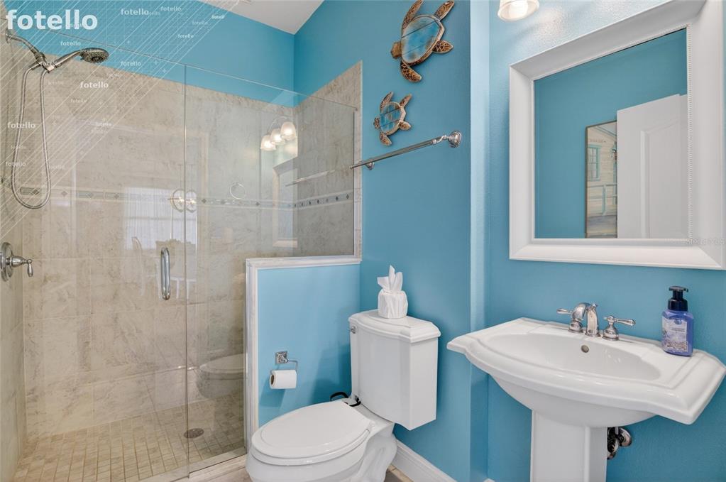 650 Setting Sun Drive Winter Garden, FL 34787 - Photo 21 of 60 a bathroom with a sink toilet and shower