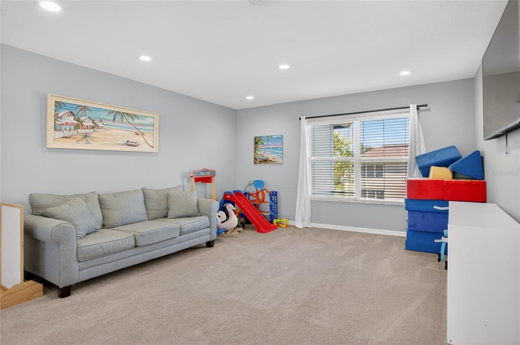 650 Setting Sun Drive Winter Garden, FL 34787 - Photo 23 of 60 a living room with furniture and a window