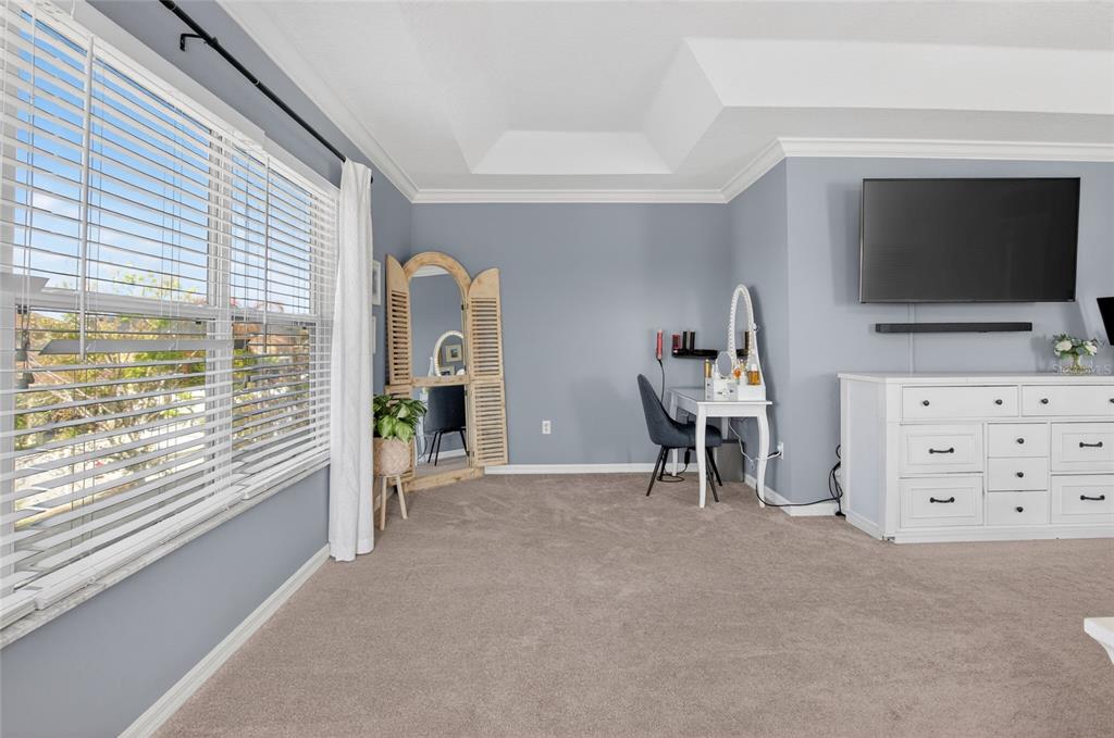 650 Setting Sun Drive Winter Garden, FL 34787 - Photo 26 of 60 a view of a livingroom with furniture an empty room and windows