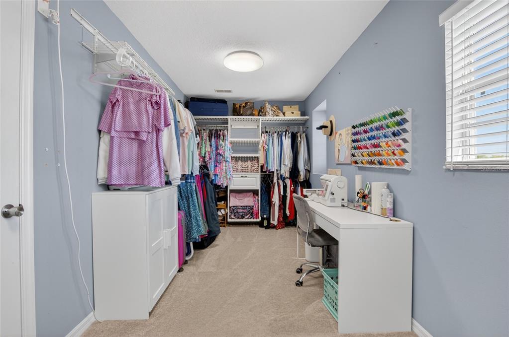 650 Setting Sun Drive Winter Garden, FL 34787 - Photo 30 of 60 a view of walk in closet with clothes and shoes