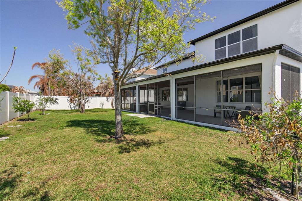 650 Setting Sun Drive Winter Garden, FL 34787 - Photo 38 of 60 a view of house with backyard and garden