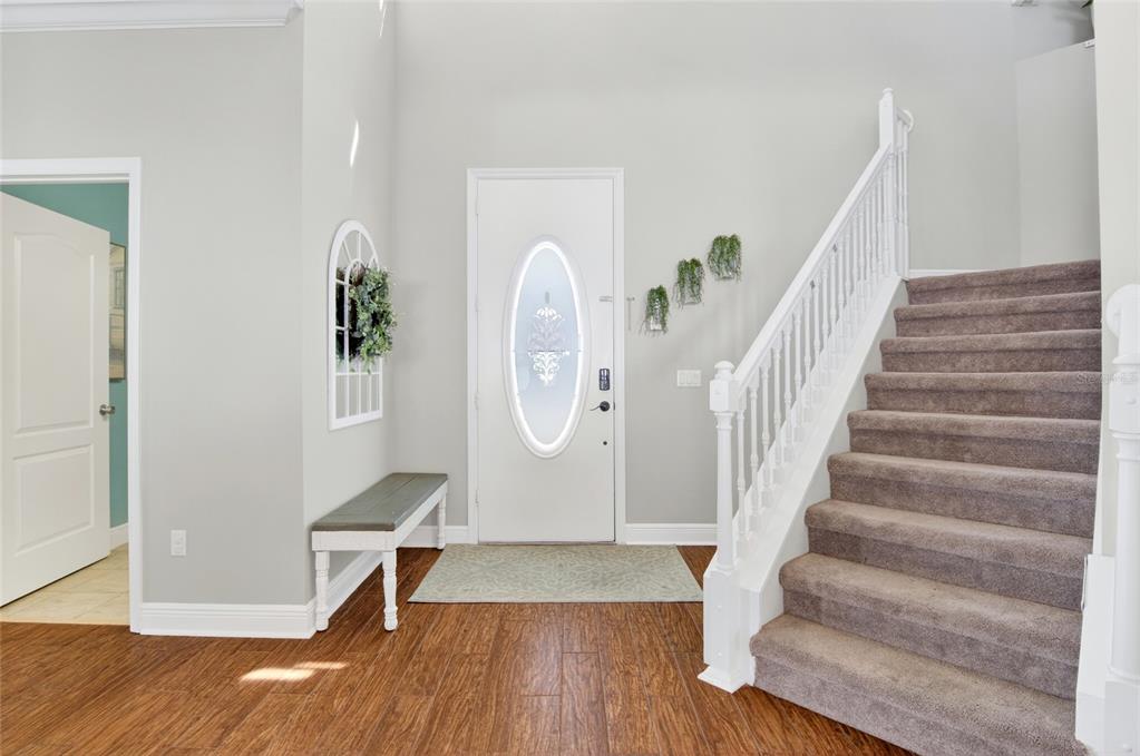 650 Setting Sun Drive Winter Garden, FL 34787 - Photo 5 of 60 a view of entryway and hall with wooden floor