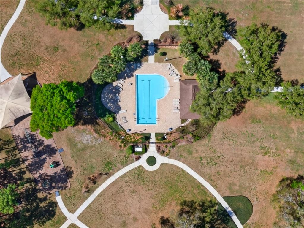 650 Setting Sun Drive Winter Garden, FL 34787 - Photo 51 of 60 an aerial view of a house with a yard and trees