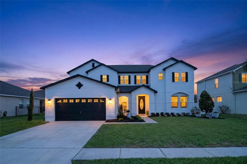 650 Setting Sun Drive Winter Garden, FL 34787 - Photo 60 of 60 a front view of a house with a yard