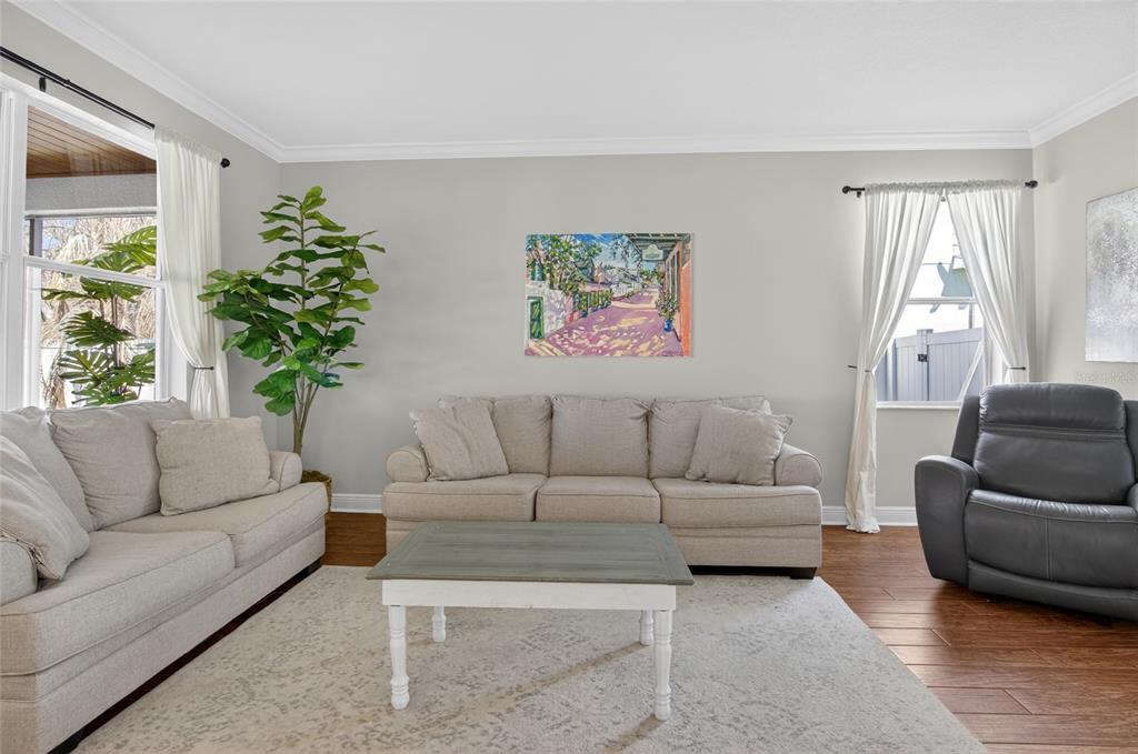 650 Setting Sun Drive Winter Garden, FL 34787 - Photo 7 of 60 a living room with furniture and a large window