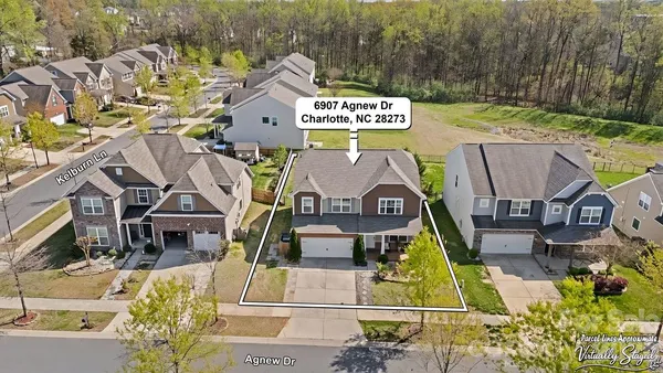 a aerial view of a house with a swimming pool