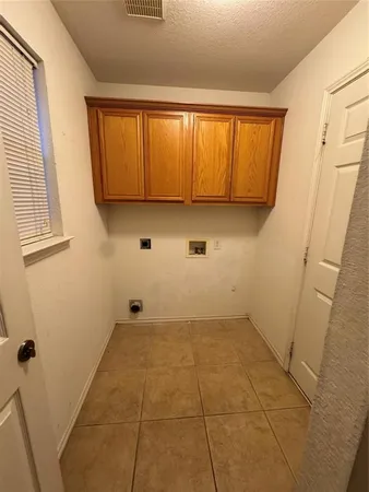 a view of a utility room with a window