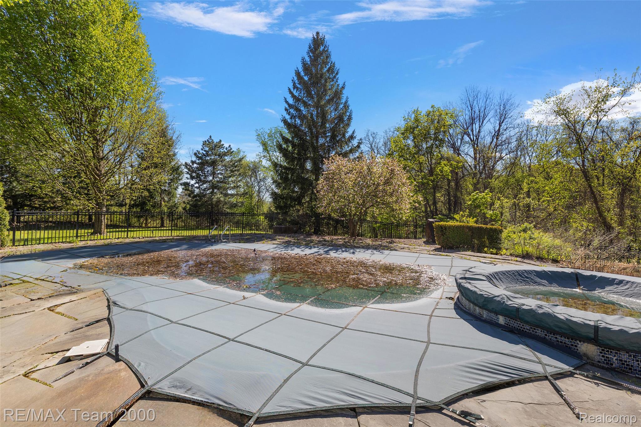 630 Sheldon Court Rochester, MI 48306 - Photo 88 of 94 View of pool featuring a jacuzzi and patio surround