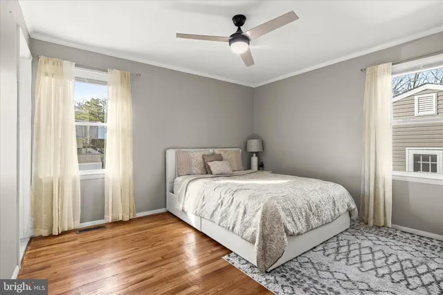 a bathroom with a granite countertop toilet sink and a mirror