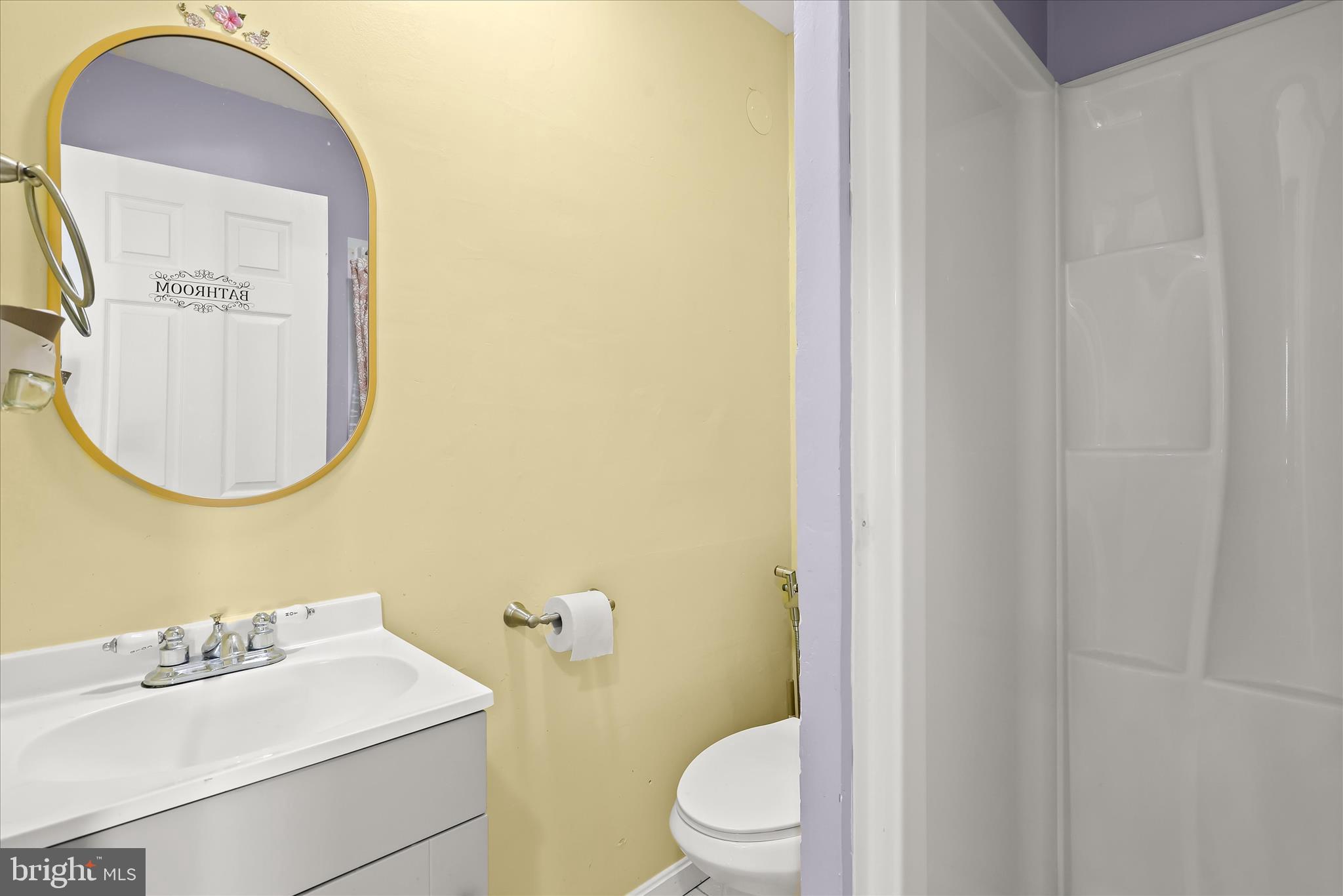 4503 Hershey Way Nottingham, MD 21236 - Photo 26 of 49 a bathroom with a toilet sink vanity and mirror