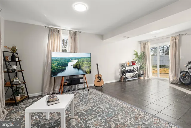 a view of a livingroom with furniture and a window