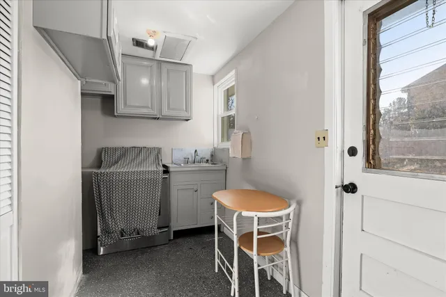 a front view of a house with a yard porch and outdoor seating