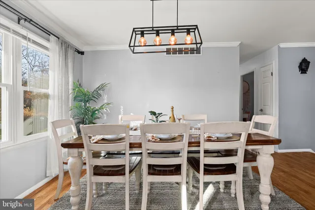 a kitchen with a table and chairs in it