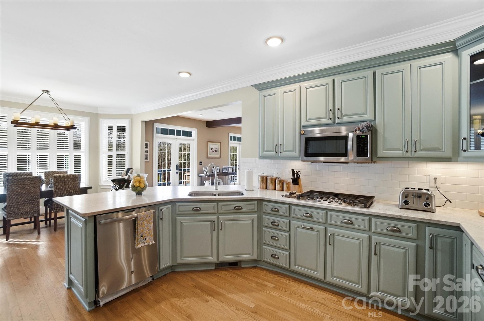 704 Mayfield Court Fort Mill, SC 29715 - Photo 20 of 48 a kitchen with stainless steel appliances granite countertop a sink a stove and cabinets