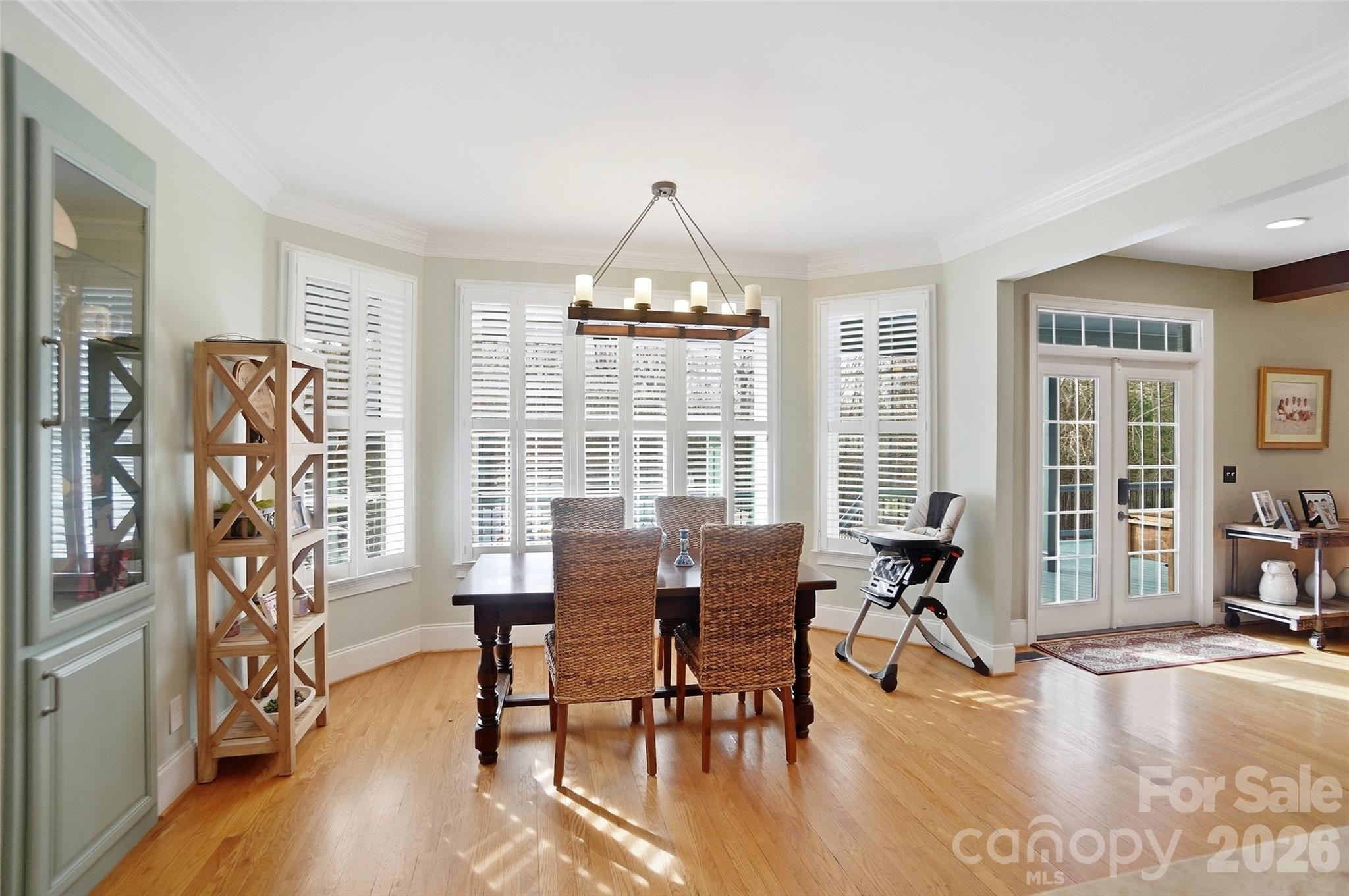 704 Mayfield Court Fort Mill, SC 29715 - Photo 21 of 48 a view of a dining room with furniture window and wooden floor