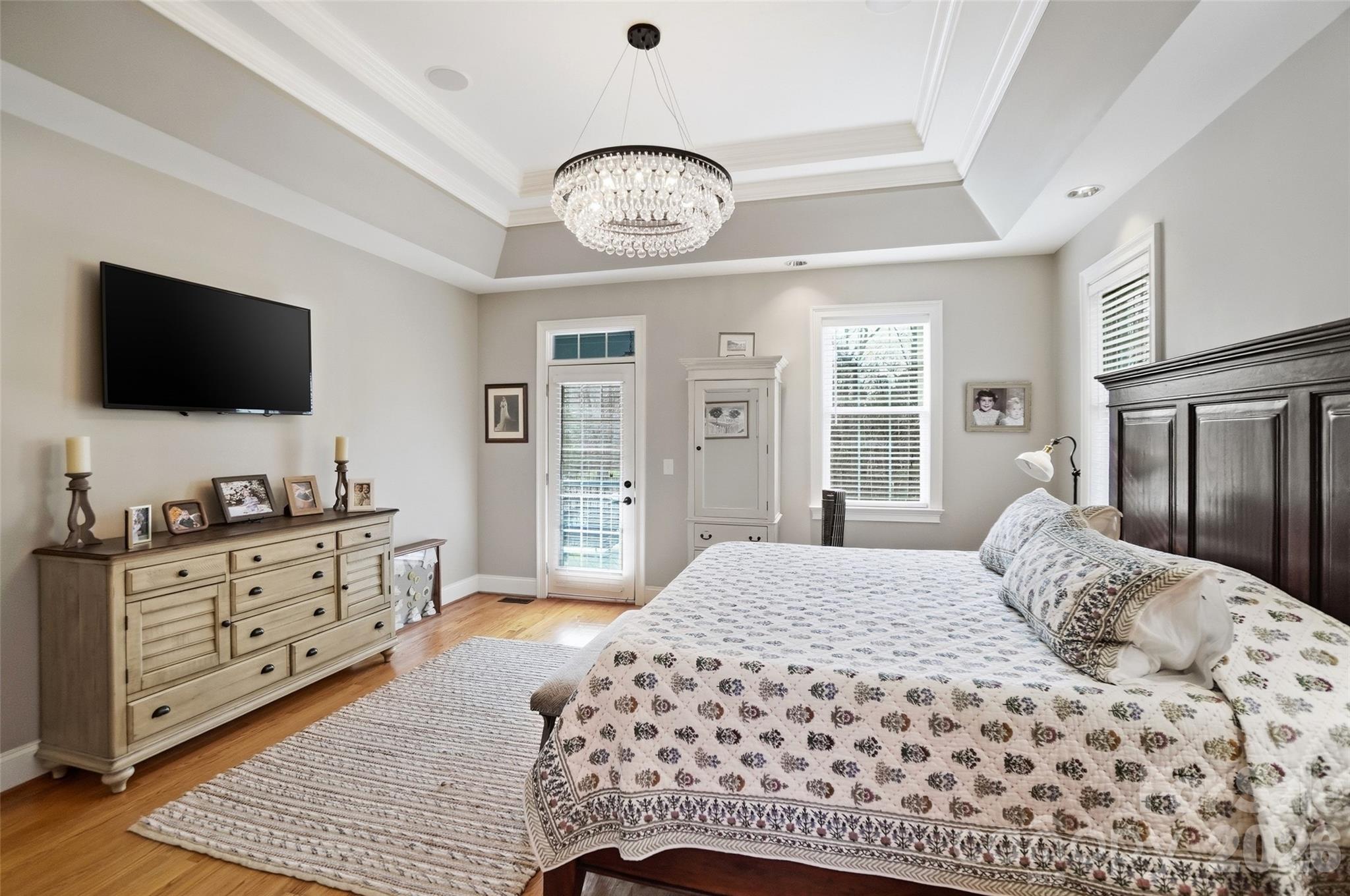 704 Mayfield Court Fort Mill, SC 29715 - Photo 24 of 48 a bedroom with a bed and a flat screen tv