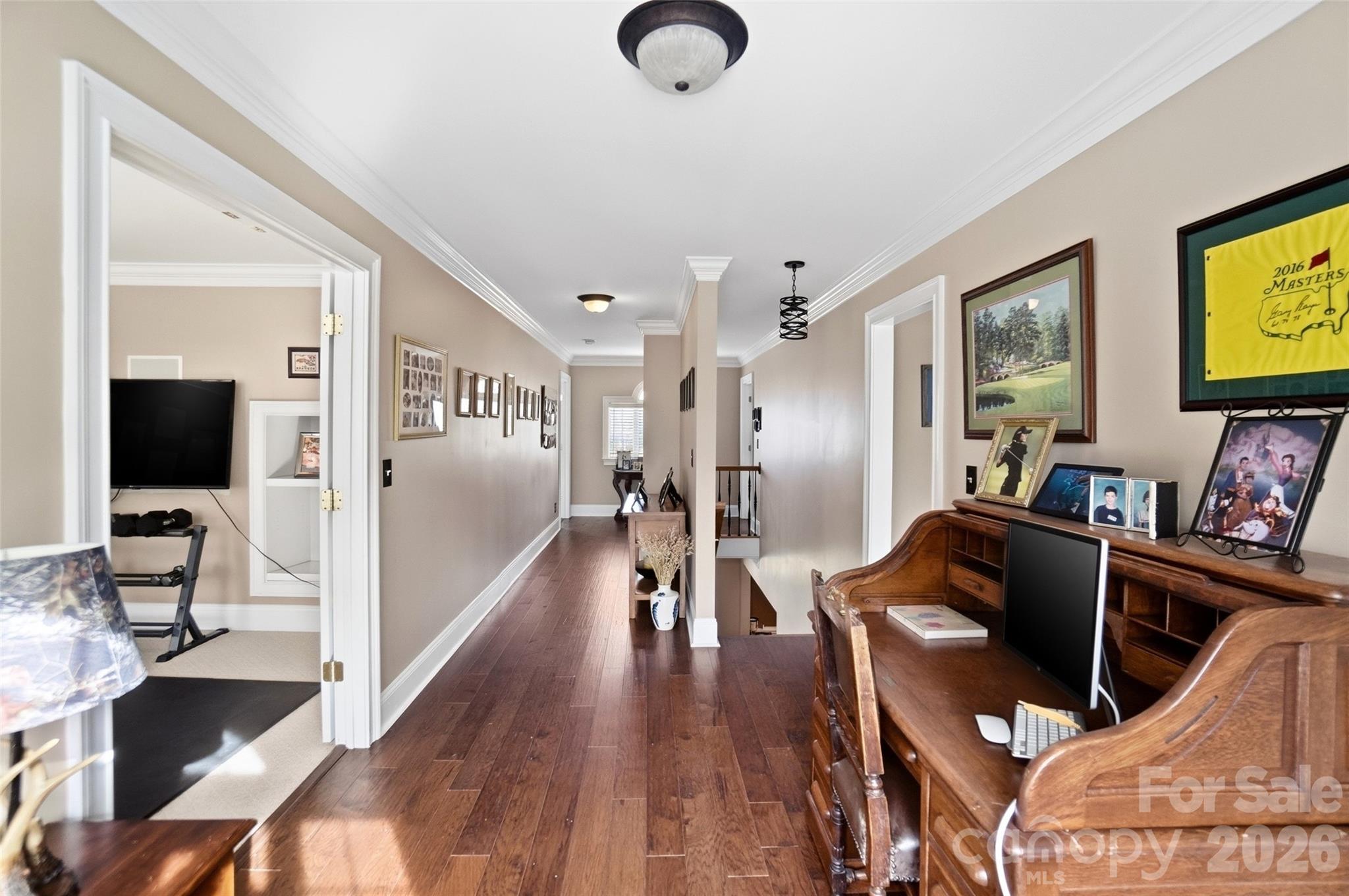 704 Mayfield Court Fort Mill, SC 29715 - Photo 28 of 48 a hallway with furniture and a flat screen tv