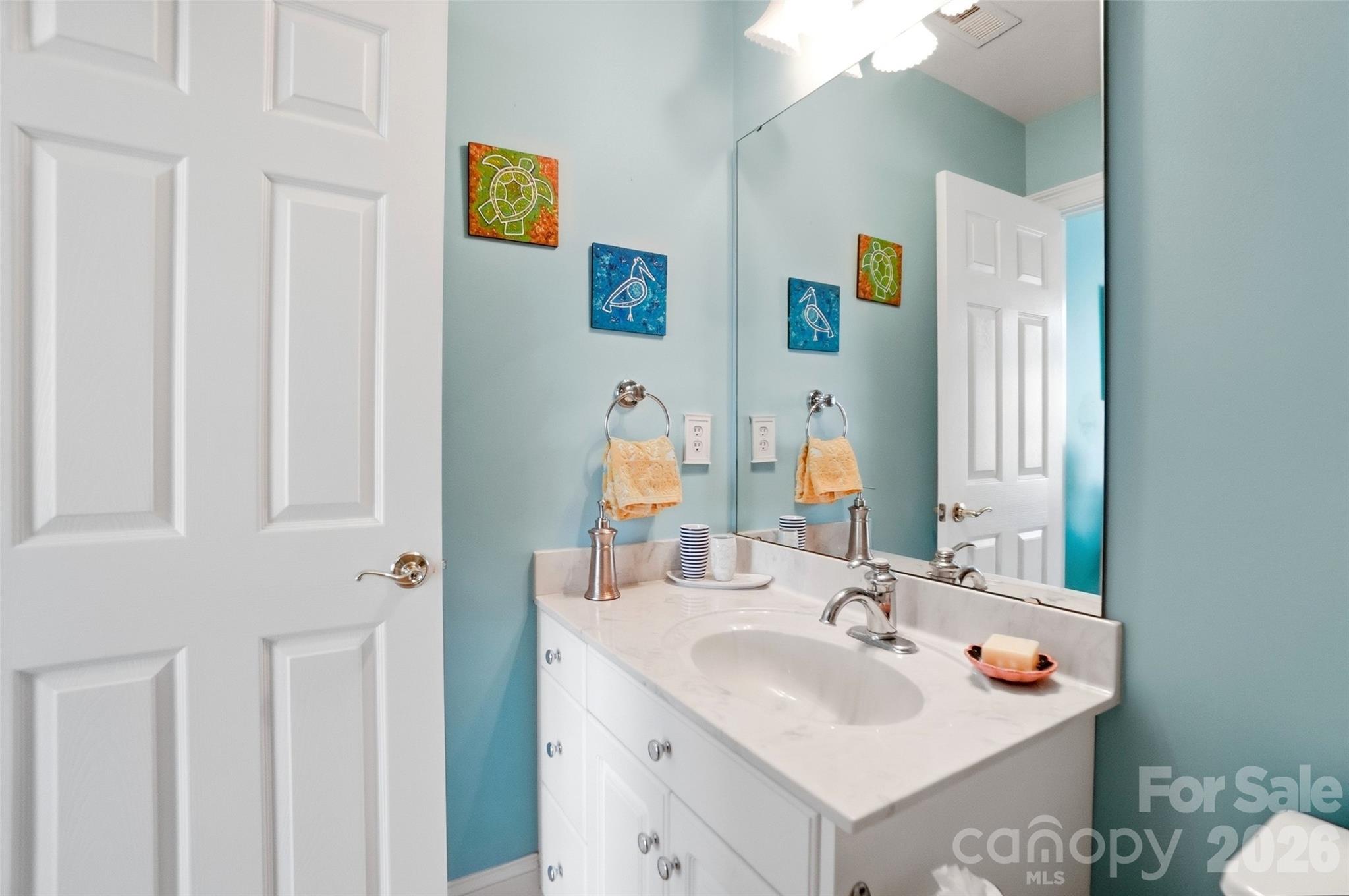 704 Mayfield Court Fort Mill, SC 29715 - Photo 30 of 48 a bathroom with a sink and a mirror