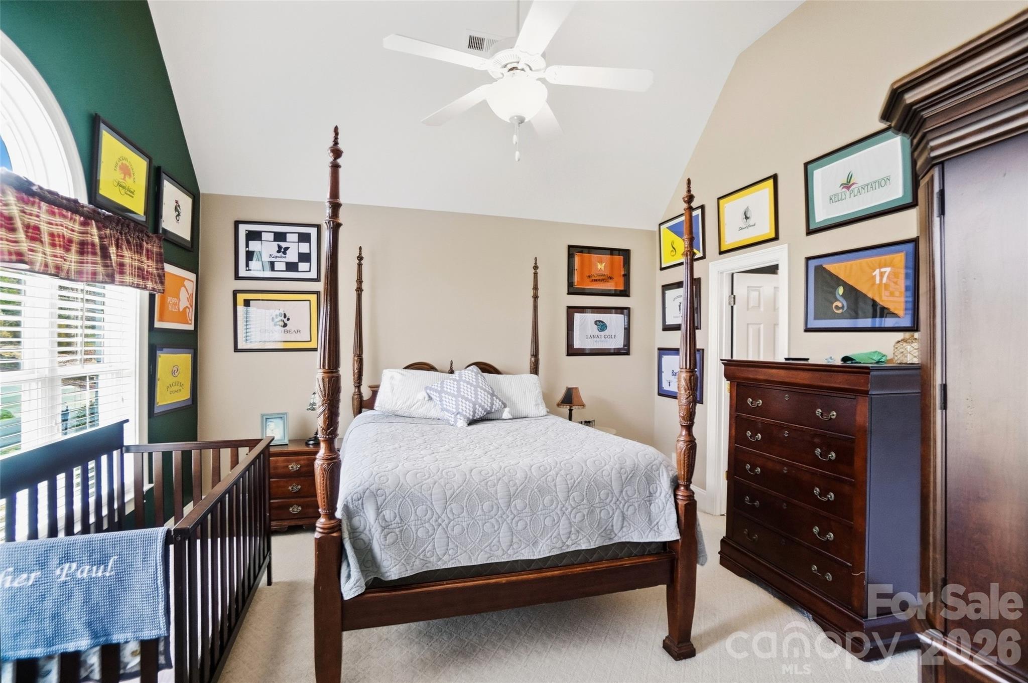 704 Mayfield Court Fort Mill, SC 29715 - Photo 31 of 48 a bedroom with a bed and a dresser